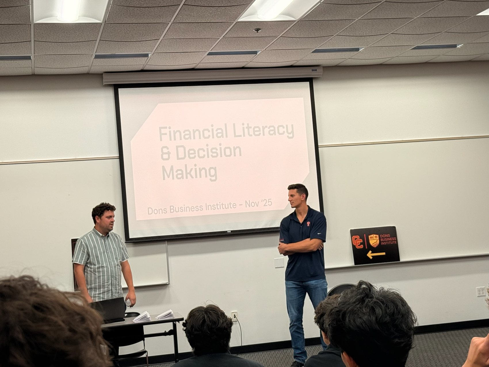 Two speakers presenting a Financial Literacy and Decision Making session to DBI students.